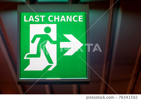 The emergency exit sign indicates the direction of way to last chance. The emergency exit sign indicates the direction of way to last chance. 76341502