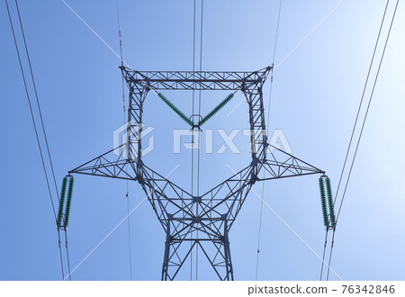 High voltage electrical power distribution turret over clear sky 76342846