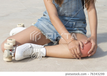 Skater with hands in pain or knee injury Skater with hands in pain or knee injury 76343299