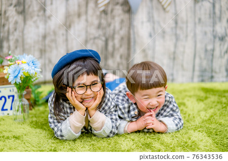Image of a child taking a photo in the studio Image of a child taking a photo in the studio 76343536