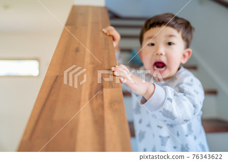 A child with a surprised expression, a boy in an unpleasant period 76343622