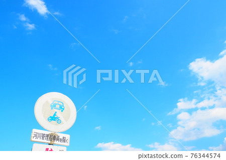 Faded sign and blue sky Faded sign and blue sky 76344574