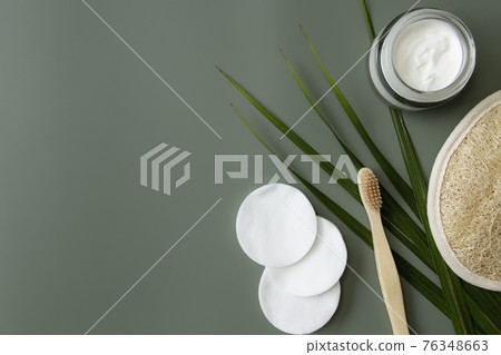 Bath accessories flat lay on green background. Plastic free environment concept 76348663