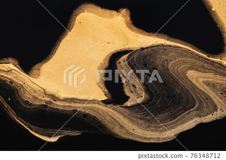 Golden slice of stone on black. Abstract liquid marble background or texture. Acrylic Fluid Art. Digital decor 76348712