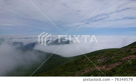 A sea of clouds that spreads when you look down from the mountain road A sea of clouds that spreads when you look down from the mountain road 76349579