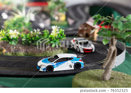 Electric slot cars on toy race track Electric slot cars on toy race track 76352325