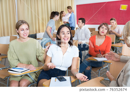 Students communicating during recess between lectures Students communicating during recess between lectures 76352674