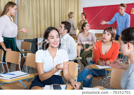 Students communicating during recess between lectures Students communicating during recess between lectures 76352701
