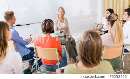 Mature female giving presentation for students Mature female giving presentation for students 76352833