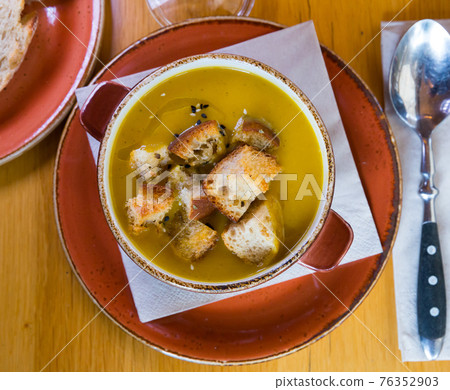 Top view of cream soup with croutons Top view of cream soup with croutons 76352903