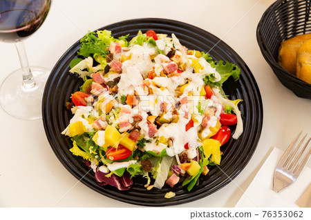close up of mediterranean cabbage salad in black bowl for lunch close up of mediterranean cabbage salad in black bowl for lunch 76353062