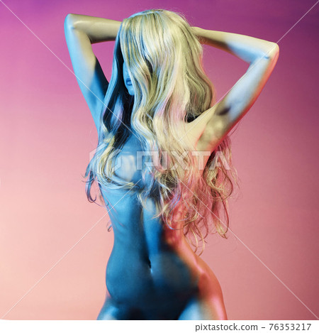 Nude sexy blonde in colorful light. Night club dance Nude sexy blonde in colorful light. Night club dance 76353217