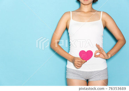 Woman with heart on stomach. Woman with heart on stomach. 76353689