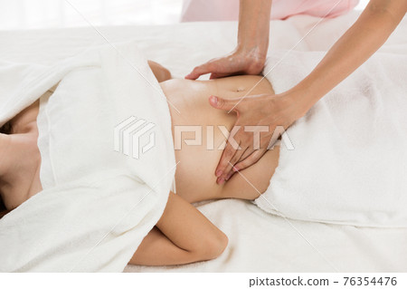 Tummy oil massage Tummy oil massage 76354476
