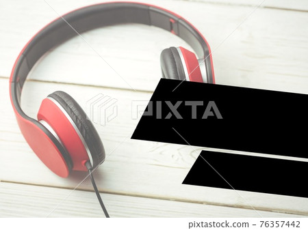 Two black stripes with copy space over headphones Two black stripes with copy space over headphones 76357442