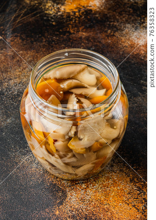 Fermented food: Mushroom preservation, on old dark rustic background Fermented food: Mushroom preservation, on old dark rustic background 76358323