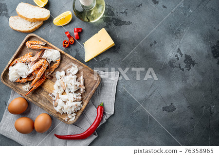 Omelette ingredients with pepper, crab meat, egg, cheese, on gray background, top view flat lay , with copyspace and space for text Omelette ingredients with pepper, crab meat, egg, cheese, on gray background, top view flat lay , with copyspace and space for text 76358965