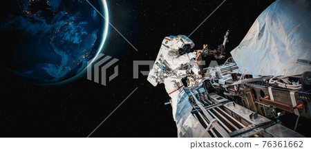 Astronaut spaceman do spacewalk while working for space station 76361662