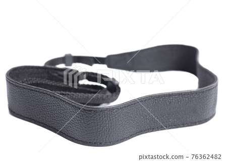 Black leather camera strap isolated on white background 76362482