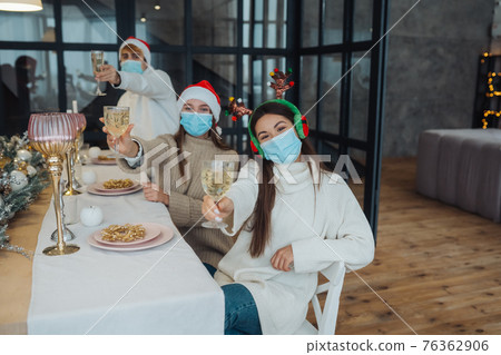 Multi-ethnic young people celebrating New year eve at party 76362906