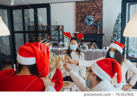 Multi-ethnic young people celebrating New year eve at party 76362908