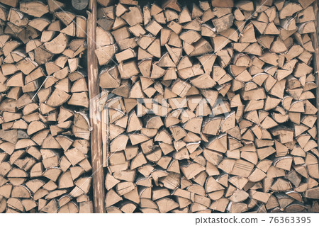 Firewood or fuelwood construction background. Forest timber energy Firewood or fuelwood construction background. Forest timber energy 76363395
