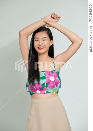 happy and active teenager on white background 76364806