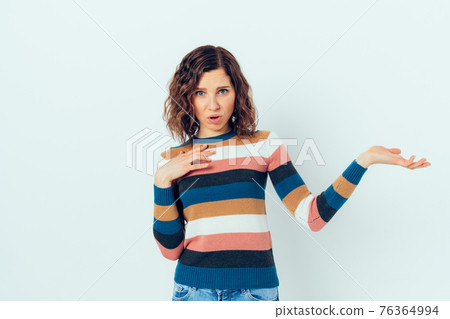 Young woman wearing casual outfit displeased Young woman wearing casual outfit displeased 76364994