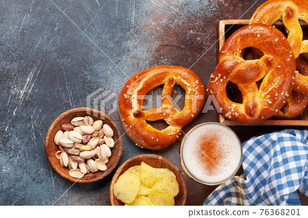 Lager beer, nuts, potato chips and fresh homemade pretzel 76368201