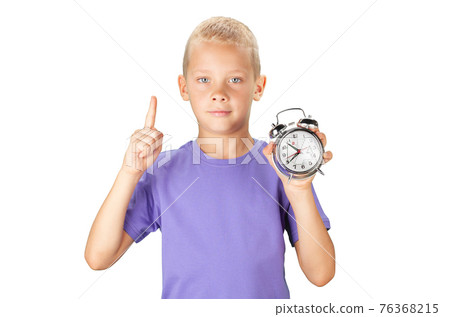 School boy showing alarm clock School boy showing alarm clock 76368215