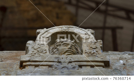 Ruins of   kampong tom Wat Temple with face of man 76368714