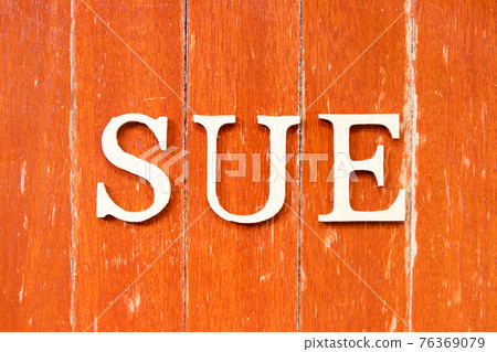 Alphabet letter in word sue on old red color wood plate background 76369079