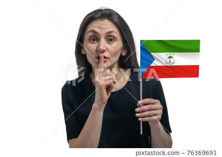 Happy young white woman holding flag of Equatorial Guinea and holds a finger to her lips isolated on a white background Happy young white woman holding flag of Equatorial Guinea and holds a finger to her lips isolated on a white background 76369691