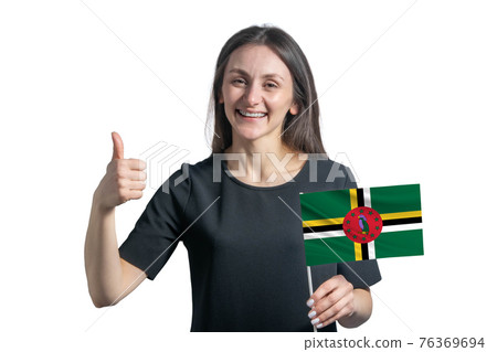 Happy young white woman holding flag of Dominica and shows the class by hand isolated on a white background Happy young white woman holding flag of Dominica and shows the class by hand isolated on a white background 76369694