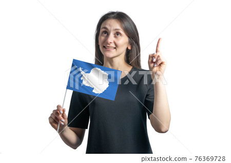 Happy young white woman holding flag of Antarctica and points thumbs up isolated on a white background 76369728
