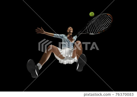 Female professional tennis player in action, motion isolated on black background, look from the bottom. Concept of sport, movement, energy and dynamic. Female professional tennis player in action, motion isolated on black background, look from the bottom. Concept of sport, movement, energy and dynamic. 76370083