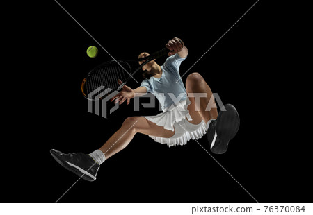 Female professional tennis player in action, motion isolated on black background, look from the bottom. Concept of sport, movement, energy and dynamic. Female professional tennis player in action, motion isolated on black background, look from the bottom. Concept of sport, movement, energy and dynamic. 76370084