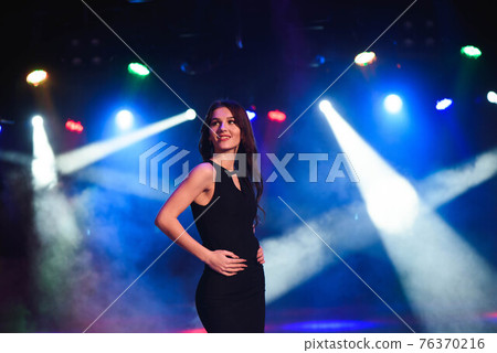 Portrait of dancing girl on disco party. 76370216
