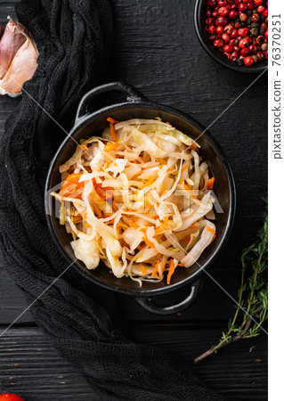 Cabbage preserving, on black wooden table background, top view flat lay 76370251