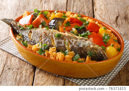 Senegalese rice and fish with vegetables Thieboudienne closeup in the dish. horizontal 76371815