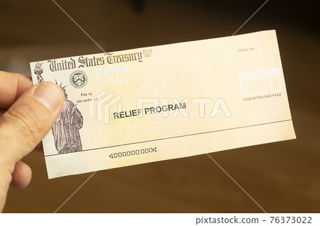 USA dollars background. American rescue plan, USA relief program, stimulus check and Act of 2021 concept. Money, business, profit and livelihood idea USA dollars background. American rescue plan, USA relief program, stimulus check and Act of 2021 concept. Money, business, profit and livelihood idea 76373022