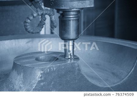The CNC milling machine cutting the cast iron by indexable tool. The CNC milling machine cutting the cast iron by indexable tool. 76374509
