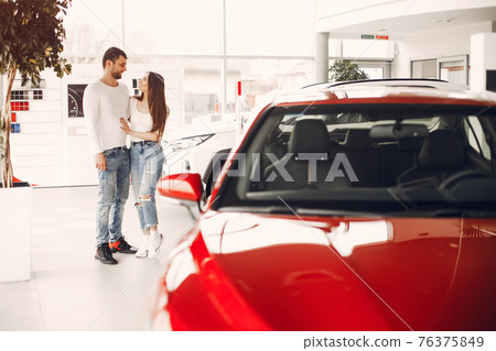Stylish and elegant family in a car salon Stylish and elegant family in a car salon 76375849