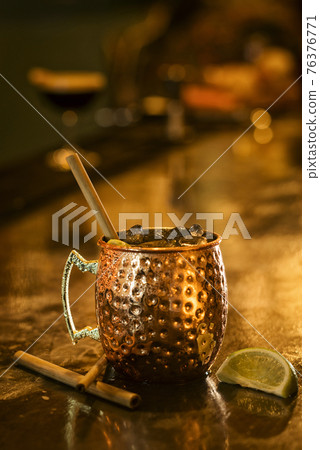 spicy rum cinnamon lime cocktail drink in bar 76376771