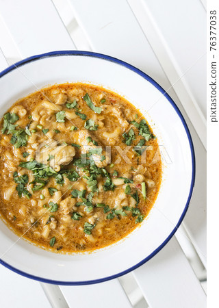 creamy spicy seafood fish soup with coriander creamy spicy seafood fish soup with coriander 76377038