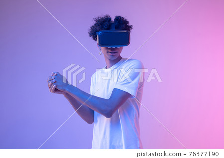 African american young guy in vr glasses enjoying the game 76377190
