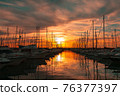 Sailboat marina at sunset 76377397