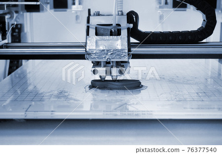 3D printer prints the form of molten plastic blue close-up. 3D printer prints the form of molten plastic blue close-up. 76377540