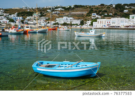 Greek fishing boat in port of Mykonos 76377583