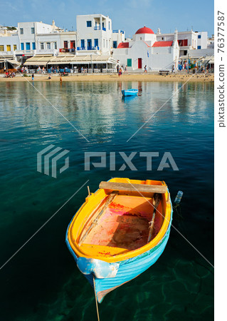 Blue fishing boat in port harbor on Mykonos island, Greece Blue fishing boat in port harbor on Mykonos island, Greece 76377587